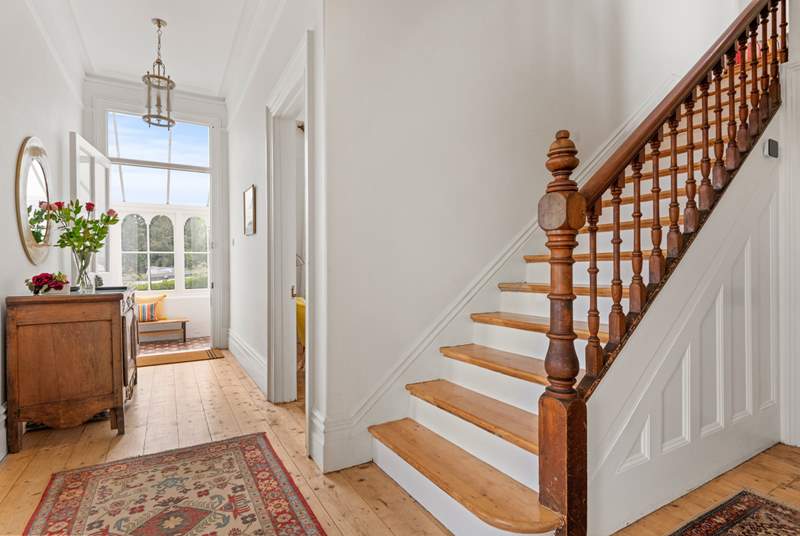 Venture up the beautiful wooden staircase to discover the other bedrooms.