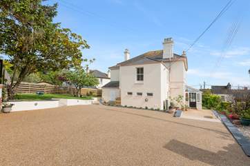 There is ample parking for three cars outside the house.