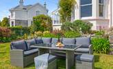 The outdoor furniture provides a great spot to settle down and enjoy a glass of something special. - Thumbnail Image