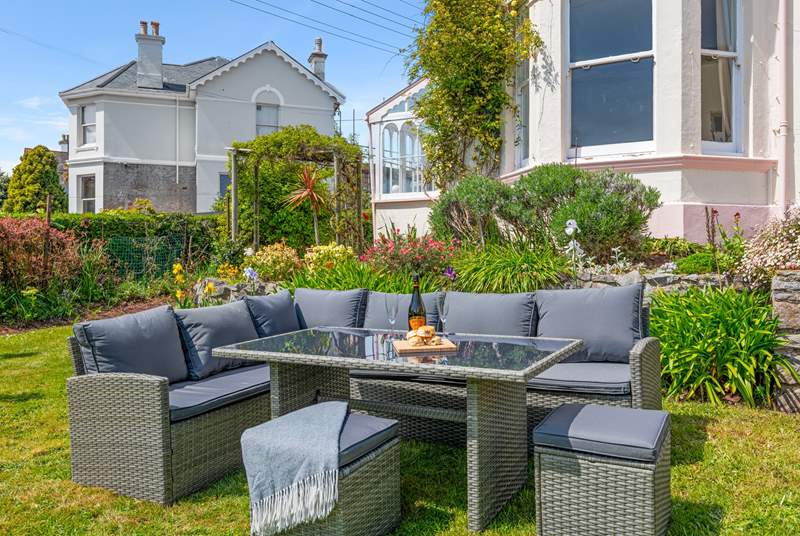 The outdoor furniture provides a great spot to settle down and enjoy a glass of something special.