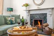 Get cosy in the evenings around the lavish fireplace.