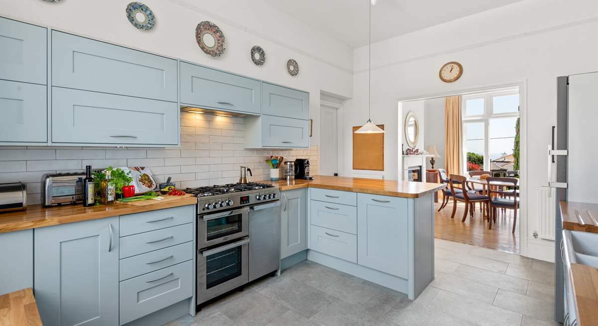 The splendid modern kitchen opens up to the dining area.