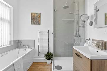 The super en suite bathroom has a bath and a shower.