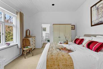 The spacious main bedroom on the ground floor has a super-king size bed and en suite.