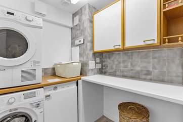 The handy utility-room is on the lower ground floor.