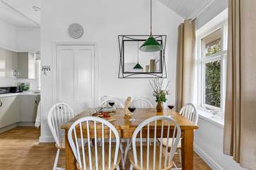 Gather everyone around the farmhouse dining-table to chat about the day's adventures.