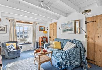 The characterful sitting-room looks out towards the harbour.