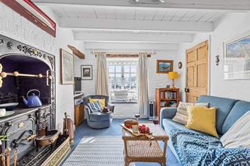 The characterful sitting-room with ornamental range.