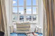 The window seat provides the perfect spot to watch the world go by.