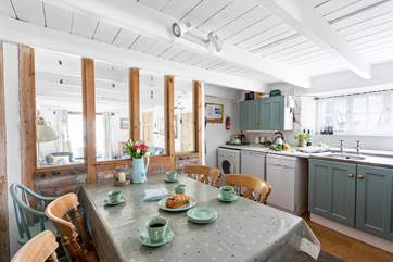 The kitchen/diner sits behind the sitting-room.
