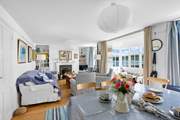 The cosy sitting/dining-room has a nautical theme.