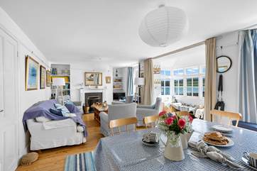 The cosy sitting/dining-room has a nautical theme.