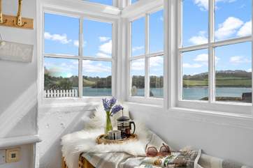 The porch entrance to Our Cottage is a great place to watch the water world sail by.
