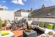 There is a seldom used patio for the adjoining property at the far side of the terrace and access may be required on limited occasions.