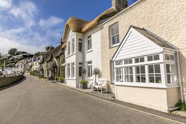 Our Cottage sits in a row of pretty Cornish cottages. The road leads to St Mawes Castle.