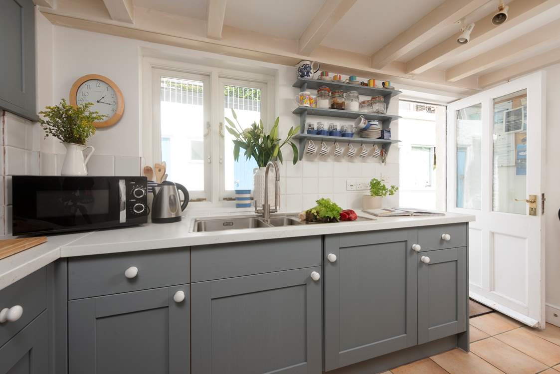 The back door leads out to the external shower-room and is perfect for storing canoes or outdoor activity equipment.