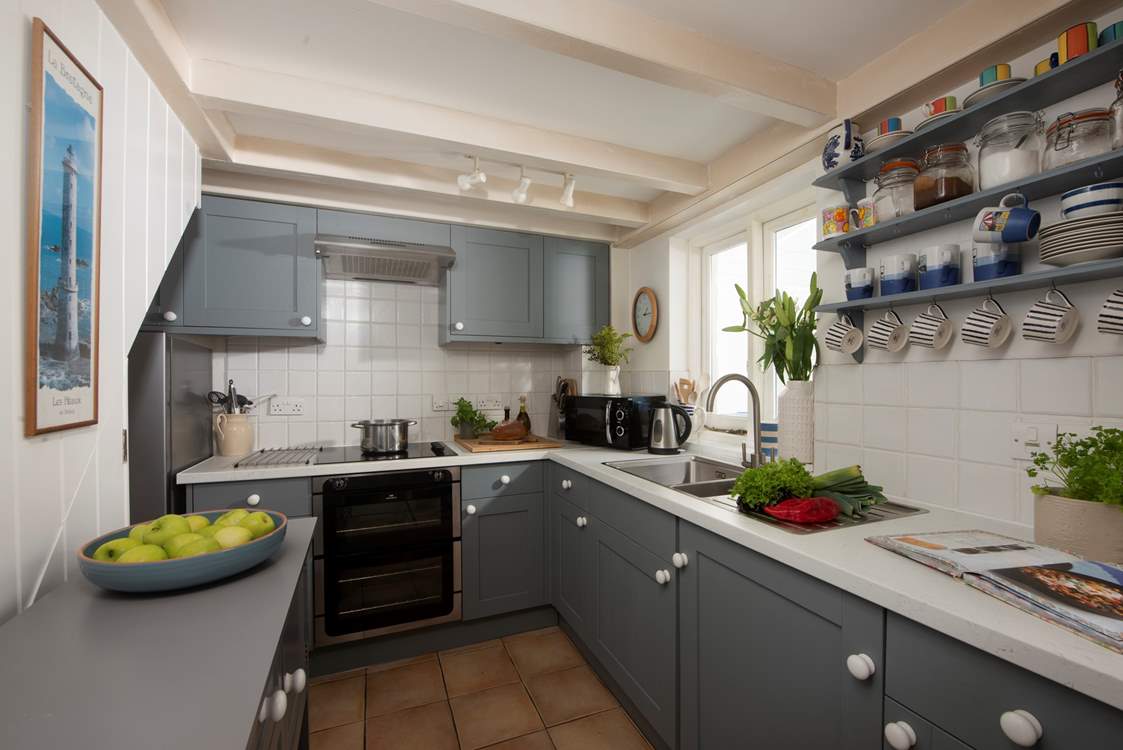 The modern kitchen has all you need including the all-important dishwasher.