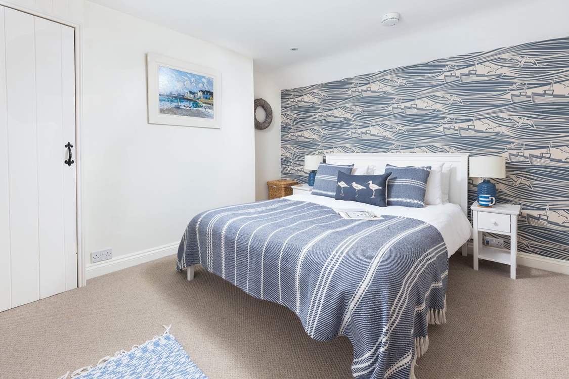 With a pretty nautical theme, the double bedroom is a delight.