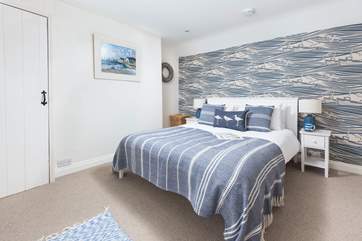 With a pretty nautical theme, the double bedroom is a delight.