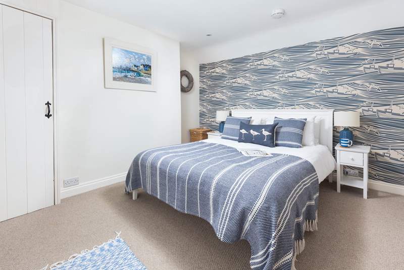 With a pretty nautical theme, the double bedroom is a delight.