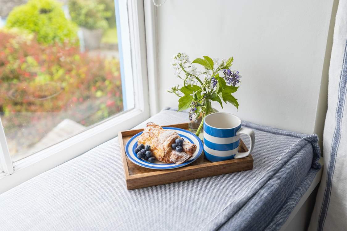 The window seat is the perfect spot for morning coffee.