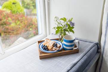 The window seat is the perfect spot for morning coffee.