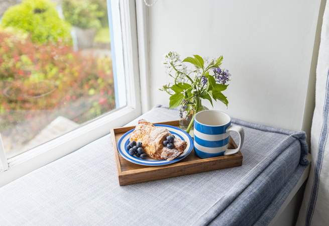 The window seat is the perfect spot for morning coffee.
