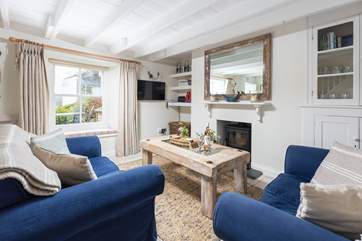 The charming sitting-room is warm and welcoming.
