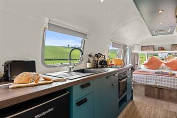 The compact kitchen has everything you'll need.