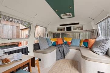A comfy and vibrant living space welcomes you as you enter.