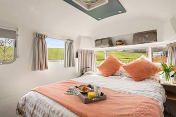 The king-size bed offers sumptuous views across the valley.