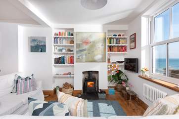The sumptuous wood-burner provides a splendid centrepiece for the space.