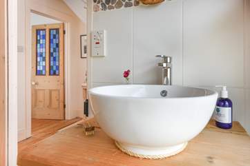 Refresh yourself at the beautifully crafted wash-basin after a long day.