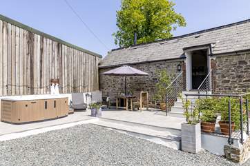 The back garden is a private haven with a fabulous hot tub.