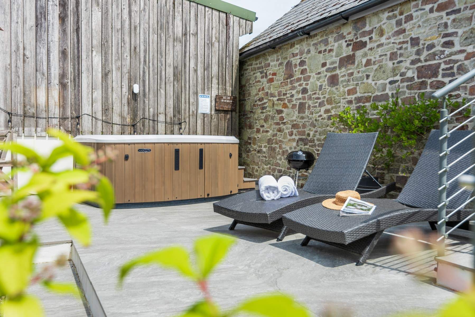 The back garden is a private haven with a fabulous hot tub.