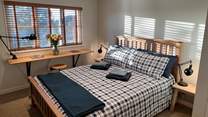 Bedroom 1 has a comfy king-size bed.