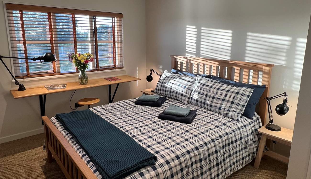 Bedroom 1 has a comfy king-size bed.