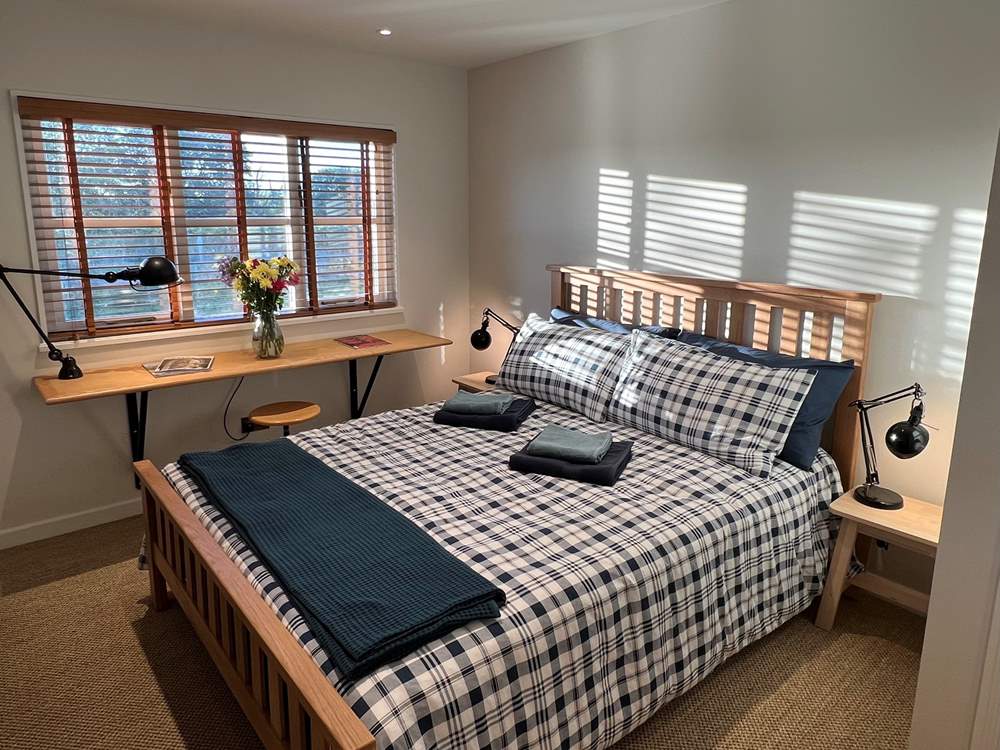 Bedroom 1 has a comfy king-size bed.