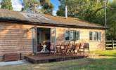 This gorgeous cabin sits in tranquil seclusion surrounded by woodland and pastures. - Thumbnail Image