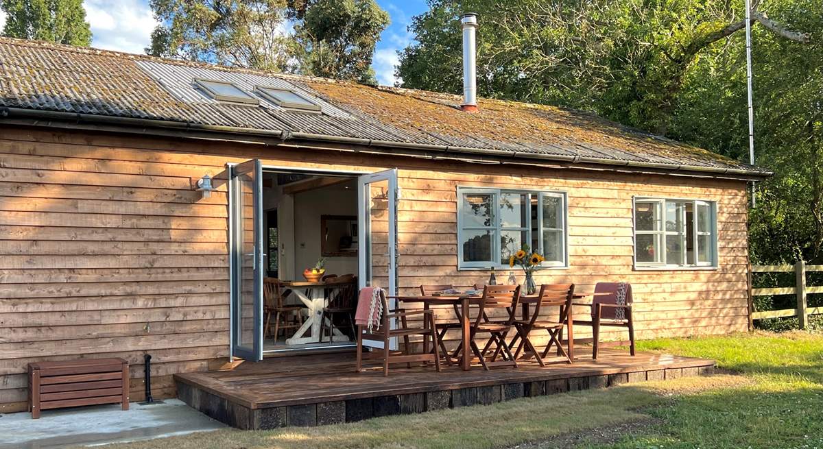 This gorgeous cabin sits in tranquil seclusion surrounded by woodland and pastures.