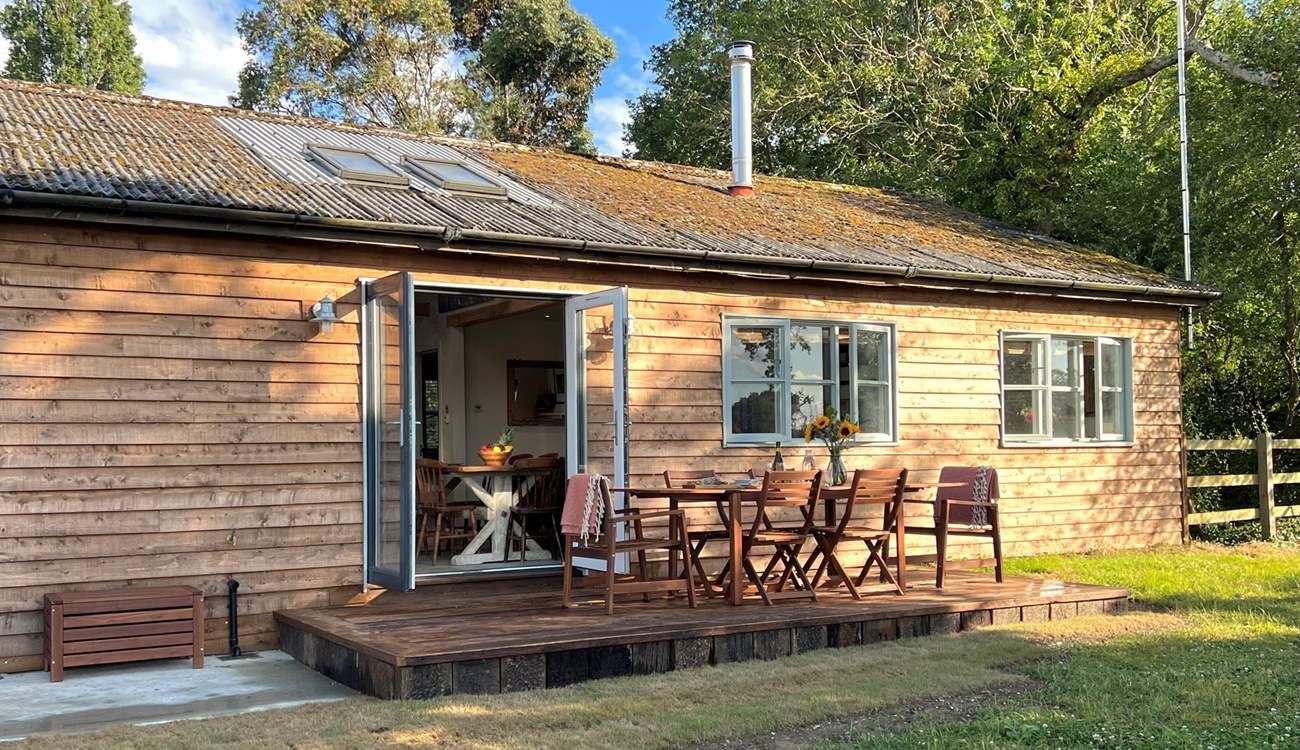 This gorgeous cabin sits in tranquil seclusion surrounded by woodland and pastures.