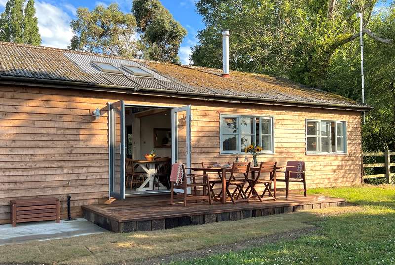 This gorgeous cabin sits in tranquil seclusion surrounded by woodland and pastures.