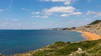 Looking towards Compton Bay. This stunning coastline often has perfect conditions for surfers and paragliders. The miles of beach are perfect for dog walkers.