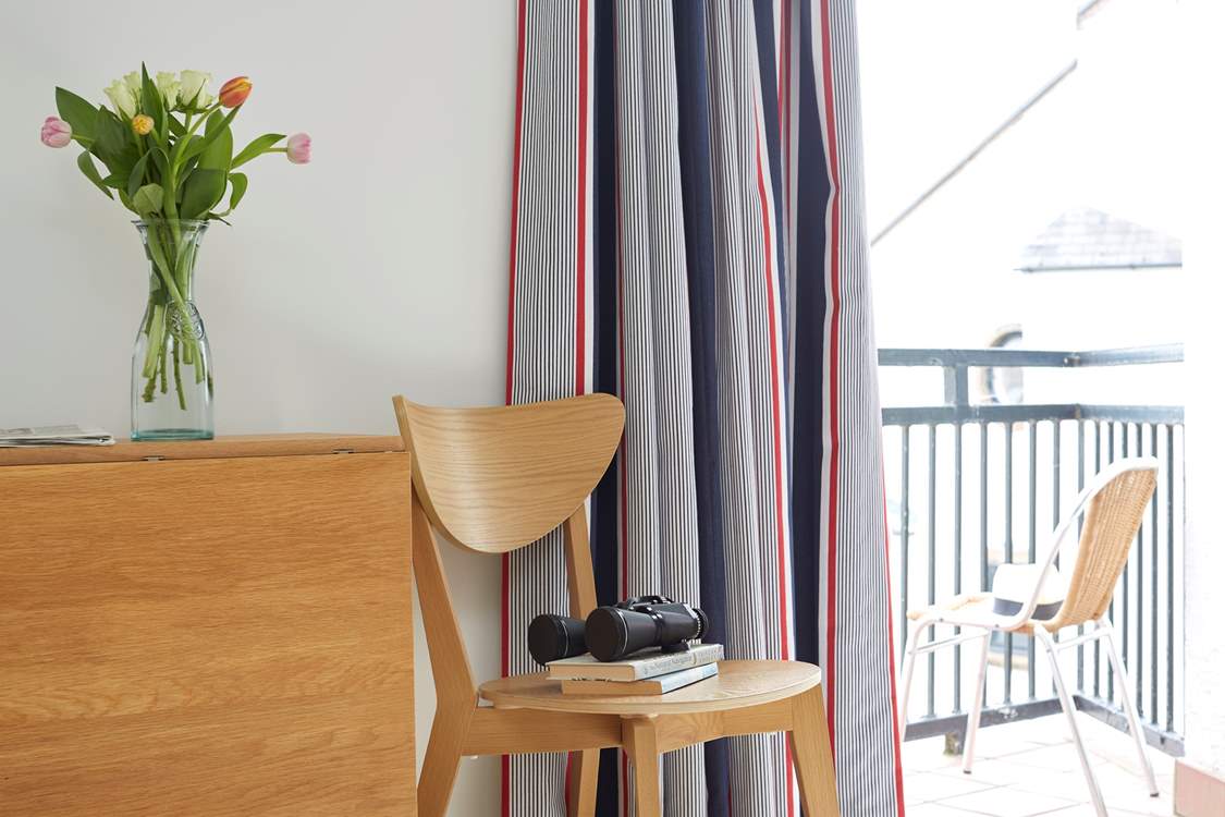 Watch the world go by from the balcony.