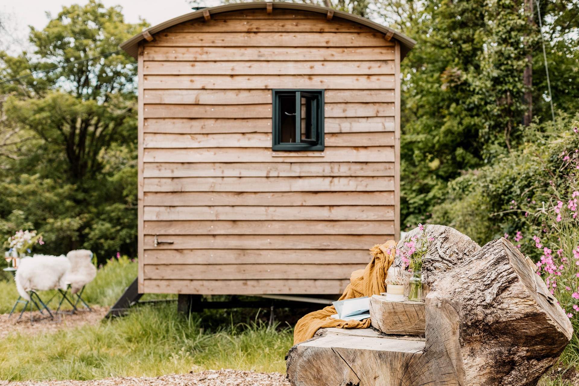 The hand-carved seat is idyllic for whiling away the hours with a good book. 