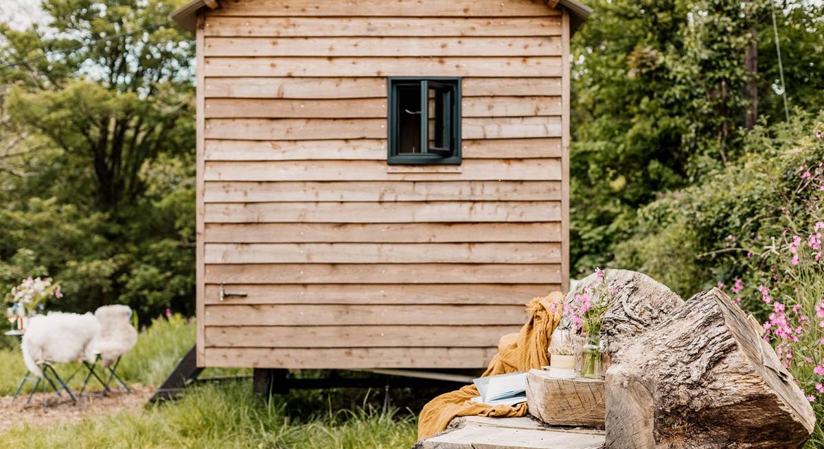 The hand-carved seat is idyllic for whiling away the hours with a good book. 