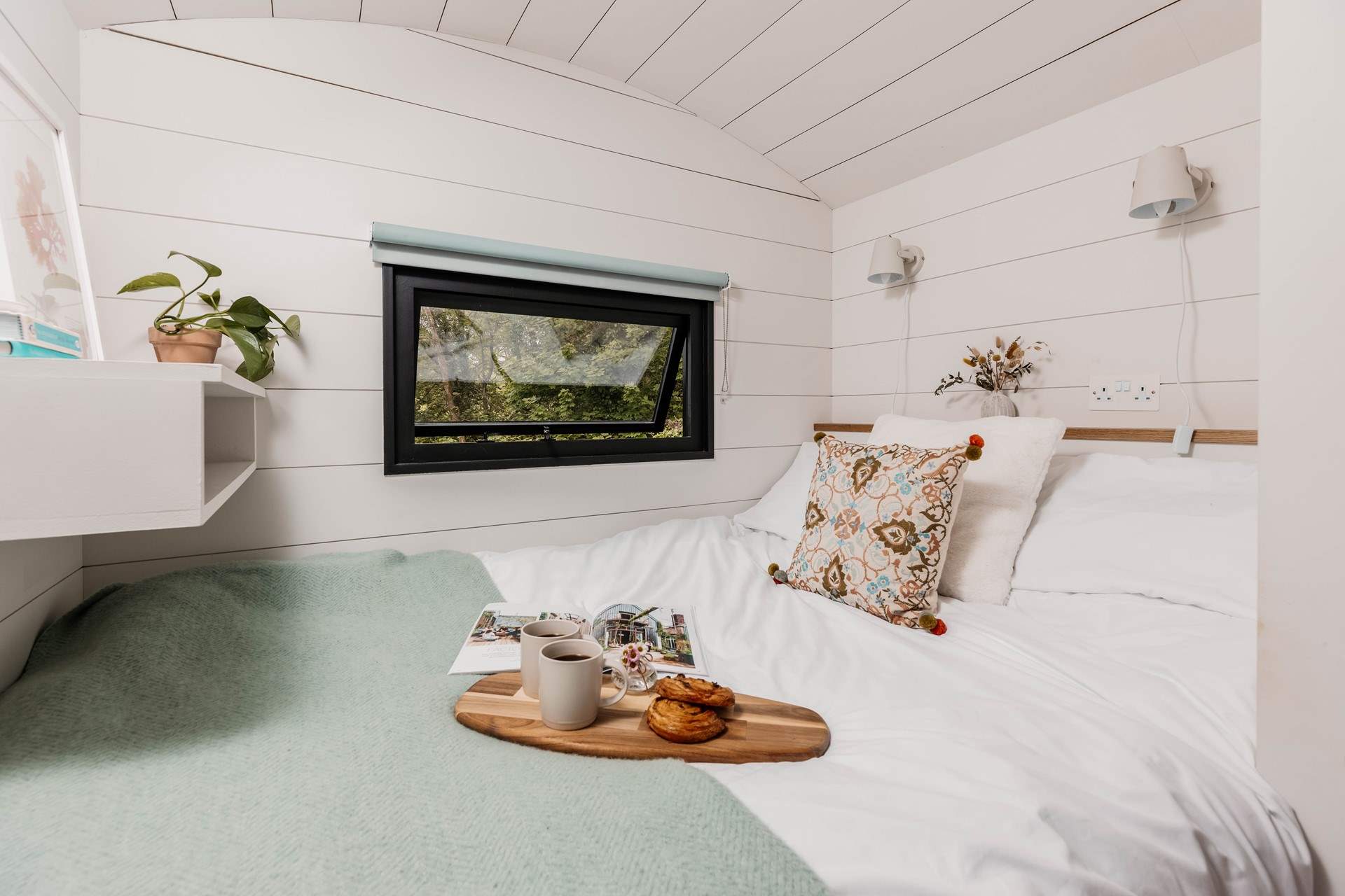 The sumptuous bed and luxurious linens promise a peaceful night's sleep. 