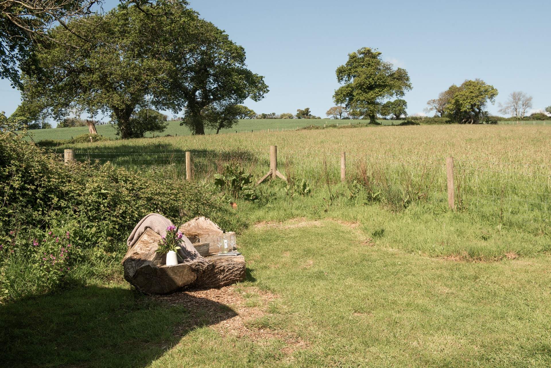 The hand-carved seat is idyllic for whiling away the hours with a good book. 