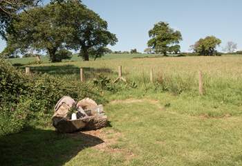 The hand-carved seat is idyllic for whiling away the hours with a good book. 