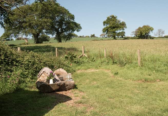 The hand-carved seat is idyllic for whiling away the hours with a good book. 